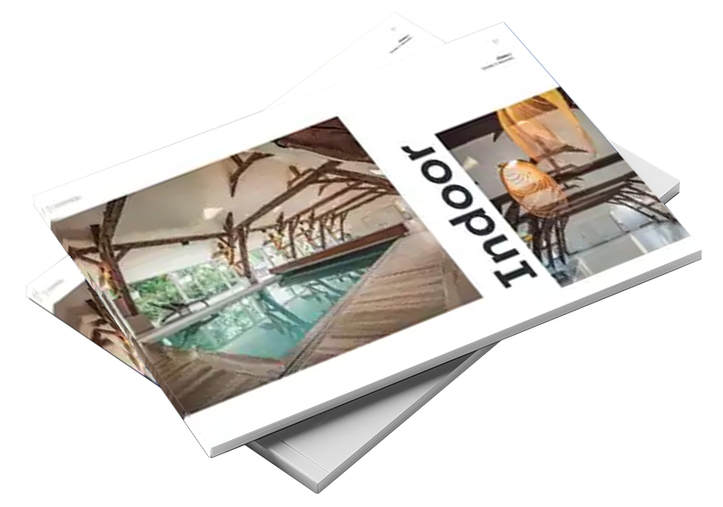 catalogue Deux brochures superposées avec une couverture montrant une piscine intérieure entourée de poutres en bois, et le mot "Indoor" en noir.